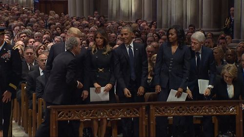 George W. Bush welcomed the Obamas to his father's memorial in Washington DC.