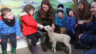 Kate Middleton, Duchess of Cambridge helps feed a Lamb with children from two local nurseries during a visit to The Ark Open Farm on February 12, 2020 in Newtownards, Northern Ireland.