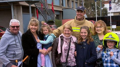 Former rugby player Trent Waterhouse celebrated completing his training with his family. 