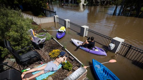 The sun returns and a spot of tanning and paddling is the order of the day in South Shepparton, as the river could be in flood for a week.