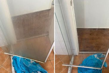 Before-and-after comparison of a shower glass screen cleaned with Coles Ultra bath and shower cleaner