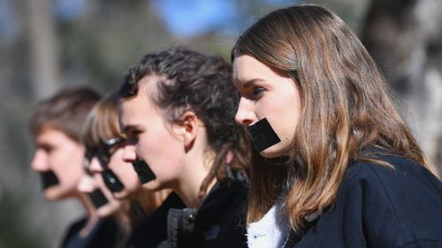 Students protest the report at ANU. (AAP)