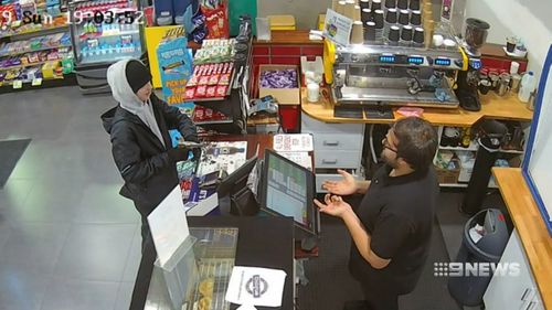 A service station worker was held at gunpoint for a packet of cigarettes.
