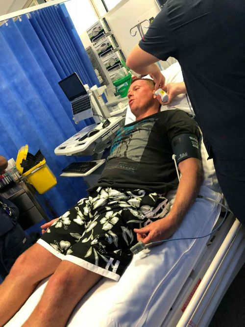 The fisherman being assessed in hospital after the ordeal. (Supplied)