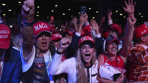 Supporters watch returns at a campaign election night watch party for Republican presidential nominee former President Donald Trump at the Palm Beach Convention Center, Wednesday, Nov. 6, 2024, in West Palm Beach, Fla. (AP Photo/Evan Vucci)