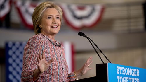 Clinton back campaigning after pneumonia scare