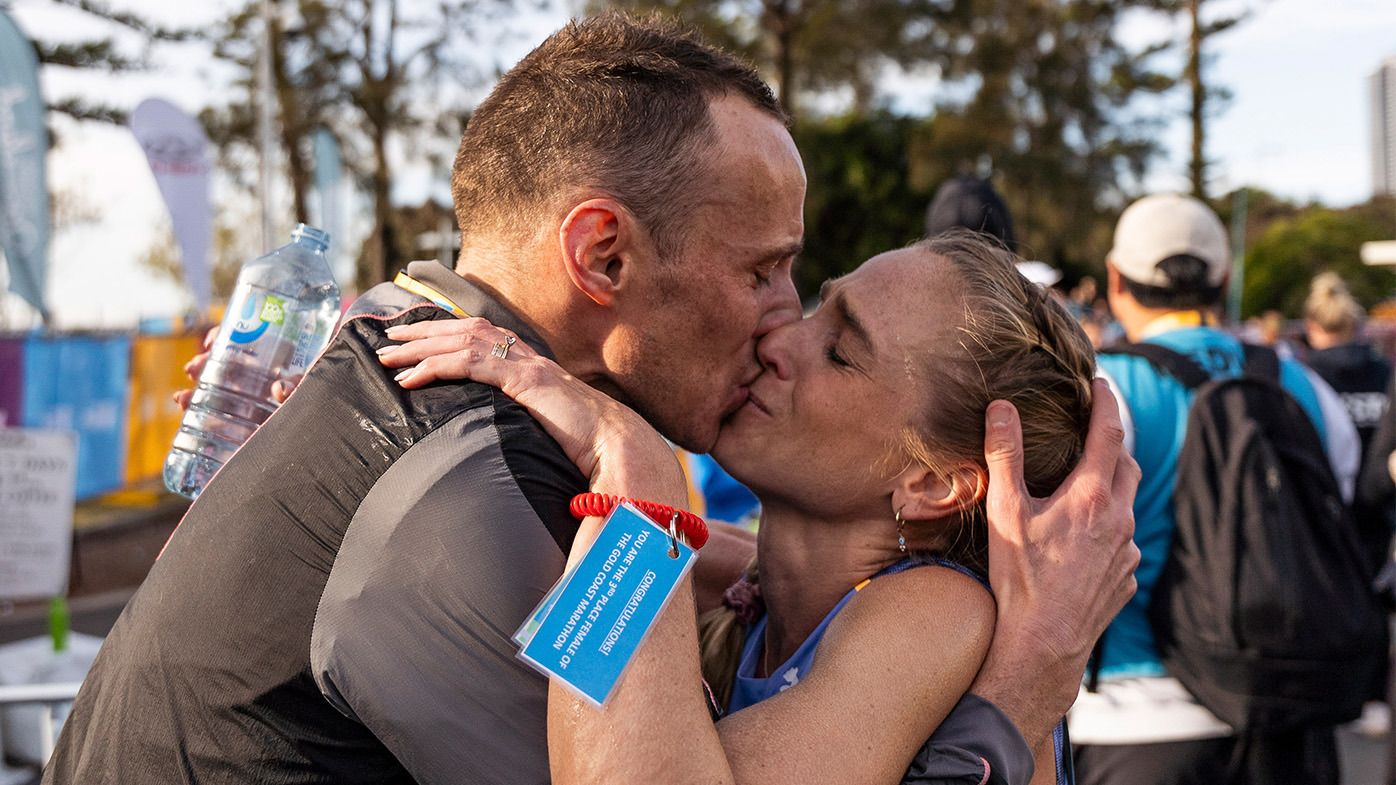 EXCLUSIVE: What Aussie athletics golden couple said in surreal embrace after marathon heroics