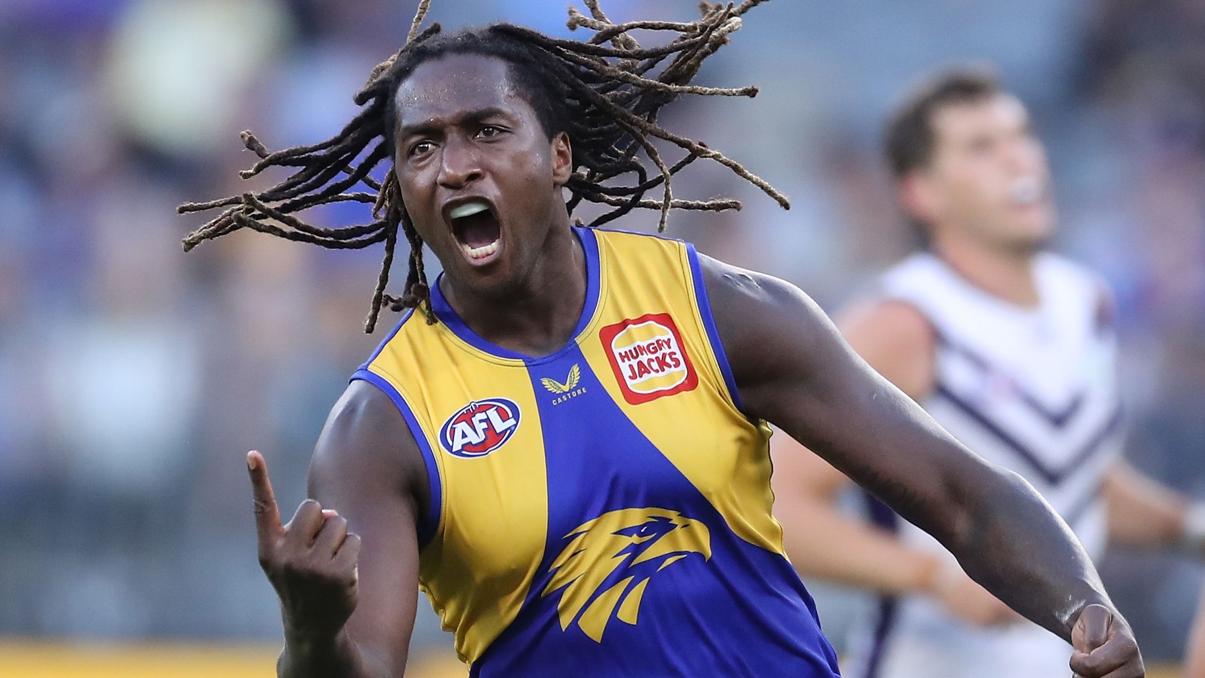 Nic Naitanui of the Eagles celebrates after scoring a goal during the 2022 AFL Round 03 match between the West Coast Eagles and the Fremantle Dockers at Optus Stadium on April 03, 2022 In Perth, Australia. (Photo by Will Russell/AFL Photos)