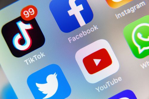 TikTok and Facebook, YouTube application on screen Apple iPhone