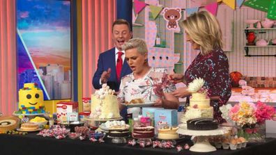 Jane de Graaff cuts a baby gender reveal cake