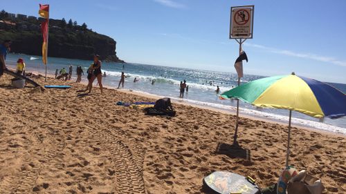 Swimmers take a dip and cool off in Bilgola Beach on Sydney's north. (Picture: Josie MacRae)