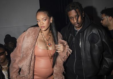 Rihanna, left, and ASAP Rocky arrive for the Off-White Ready To Wear Fall/Winter 2022-2023 collection, unveiled during Fashion Week in Paris, Monday, February 28, 2022. (Photo by Vianney Le Caer/Invision/ period)