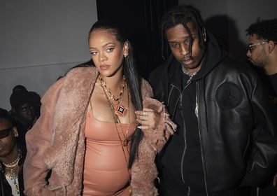 Rihanna, left, and ASAP Rocky arrive for the Off-White Ready To Wear Fall/Winter 2022-2023 fashion collection, unveiled during the Fashion Week in Paris, Monday, Feb. 28, 2022. (Photo by Vianney Le Caer/Invision/AP)