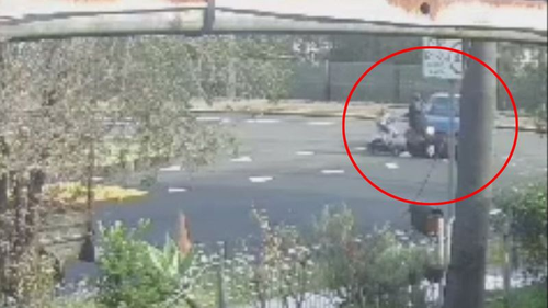 CCTV footage shows the moment the blue Mitsubishi turns into the street, striking the woman as she crosses the road.