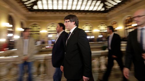 Catalan regional President Carles Puigdemont walks into the Catalan parliament. (AP)