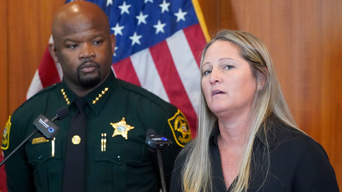 Broward Sheriff's Office Cold Case Unit Sgt. Kami Floyd, right, speaks as Sheriff Gregory Tony looks on during a news conference, Tuesday, June 7, 2022, at the BSO Public Safety Building in Fort Lauderdale, Florida.