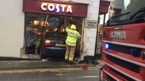 Woman killed as car crashes into UK coffee shop