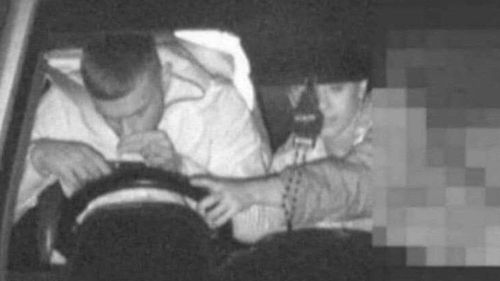 An image released by NSW Police allegedly shows a man using a mobile phone while driving.