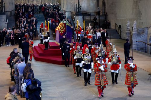 Royal guards change duties where Queen Elizabeth II's coffin is lying in state.