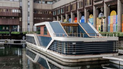 The houseboat named Port moored at St Katherine's Dock in London.