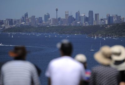 Thousands of spectators line Sydney harbour to watch the race start.