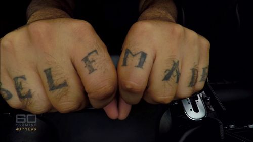 Karagoizis wears his success on his knuckles. (60 Minutes)