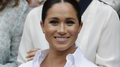 FILE - In this July 13, 2019 file photo Meghan, Duchess of Sussex smiles while sitting in the Royal Box on Centre Court to watch the women&#x27;s singles final match between Serena Williams, of the United States, and Romania&#x27;s Simona Halep on at the Wimbledon Tennis Championships in London. A British judge ruled Thursday Feb. 11, 2021, that a newspaper invaded Duchess of Sussex&#x27;s privacy by publishing personal letter to her estranged father. (AP Photo/Ben Curtis, File)