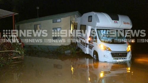 Forty-two people were rescued from a flooded Cairns caravan park. (9NEWS)