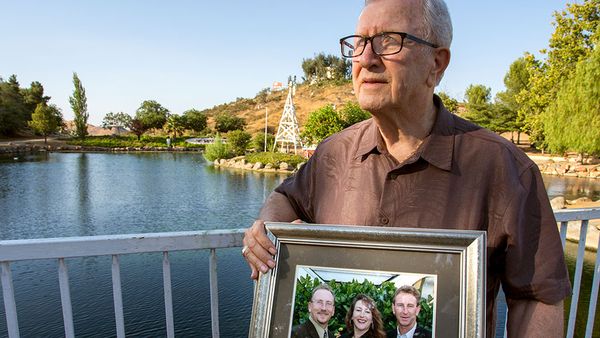 Frank J Kerrigan clutches photo of his children. Photo: AAP