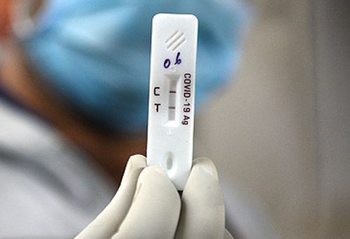 Postive COVID-19 rapid antigen test (Getty)