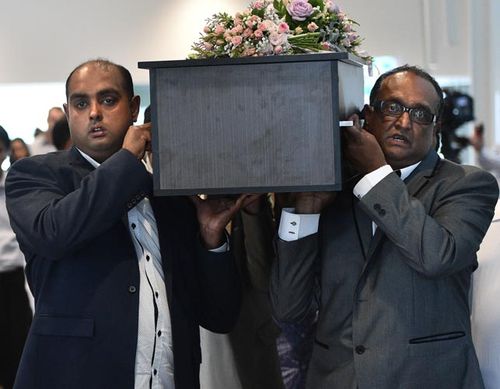 Sameer Sahib and Sanaya's grandfather carrying her in a coffin the men had hand made. (AAP)