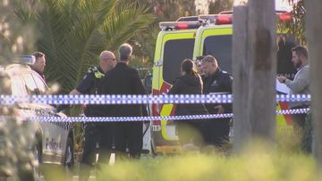 A suspect covered in blood has been arrested on the side of the road in Melbourne after another man was stabbed to death at a resort and day spa nearby.
