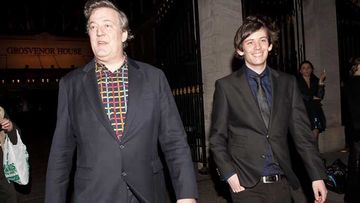 Stephen Fry and Elliott Spencer on March 30 last year. (Getty)