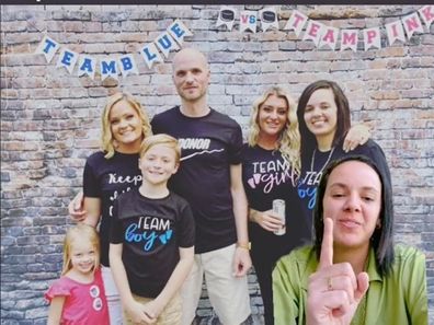 Woman on greenscreen pointing at a family photo in the background.