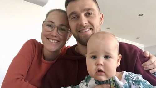 Ella Hayes and Dale Fletcher with their son Marlow. The young family is also facing the prospect of Mr Fletcher having to travel overseas for his visa to be finalised.