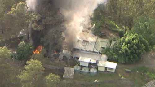 Large fire spread to home after engulfing shed at The Gap, in Brisbane's west