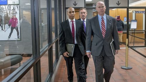 Former Minneapolis police officer Mohamed Noor, center, arrives for the first day of jury selection with his attorneys Peter Wold, left, and Thomas Plunkett, right, on Monday, April 1, 2019 at the Hennepin County Government Center in Minneapolis.