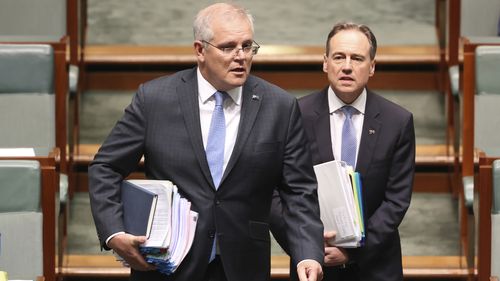 Prime Minister Scott Morrison and Minister for Health and Aged Care Greg Hunt during Question Time at Parliament House in Canberra.