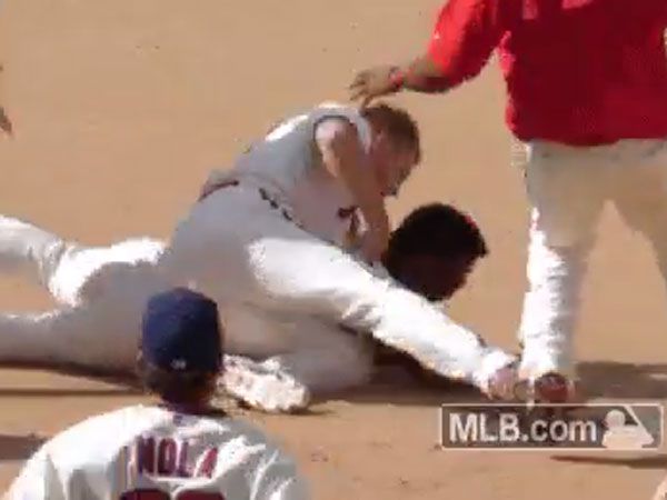 What made this baseballer tackle and punch a teammate?