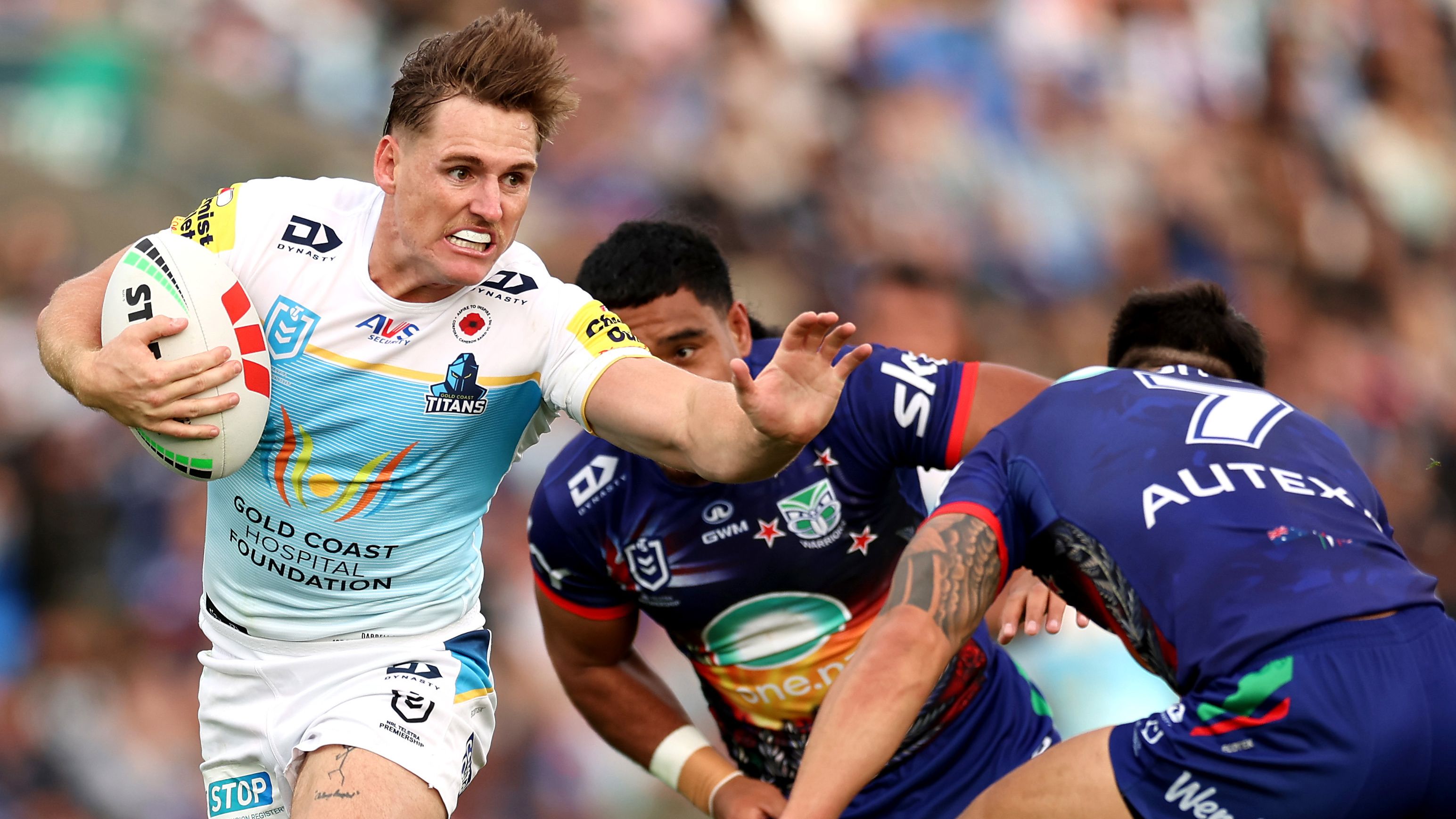 AJ Brimson is tackled during the round eight NRL match between the Warriors and the Gold Coast Titans.