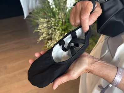 Rachel Griffiths reveals 'sneaky' flats hidden in her bag on Derby Day.