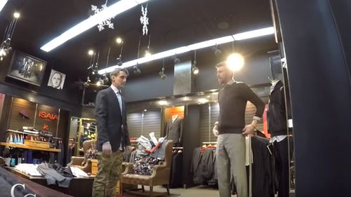 Alex can't believe he's getting fitted for a $5,000 suit, the day before the job interview. Source: YouTube