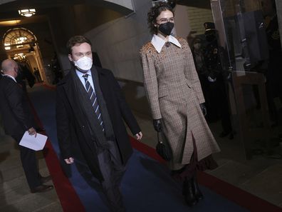 From left, Cole Emhoff and Ella Emhoff, the stepchildren of Vice President-Elect Kamala Harris arrive for the inauguration of President-elect Joe Biden on the West Front of the U.S. Capitol on Wednesday, Jan. 20, 2021 in Washington.  (Win McNamee/Pool Photo via AP)