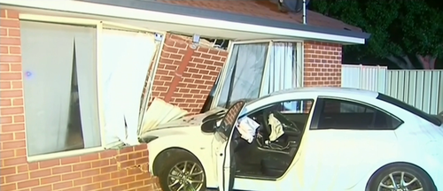 A man was woken up by a car crashing into his home.
