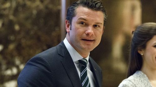 FILE - Pete Hegseth walks to the elevator for a meeting with President-elect Donald Trump at Trump Tower in New York, December 15, 2016. (AP Photo/Evan Vucci, File)