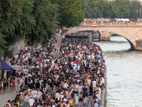 PARIS, FRANCE - JUNE 21: Thousands of people gather at the Chatelet district and on the banks of the Seine to celebrate Fete De La Musique 2025 as bands and DJ's play across Paris, France on June 21, 2025. (Photo by Luc Auffret/Anadolu via Getty Images)