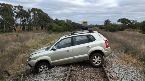 A man has been charged after allegedly stealing his boss's car while drunk and dumping it on train tracks.