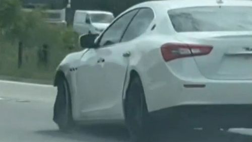 A Gold Coast family woke in the night to three strangers threatening them with a gun before taking off in their luxury car, sparking a major police chase.