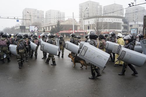 Riot police gather to block demonstrators during a protest in Almaty, Kazakhstan, Wednesday, Jan. 5, 2022. 