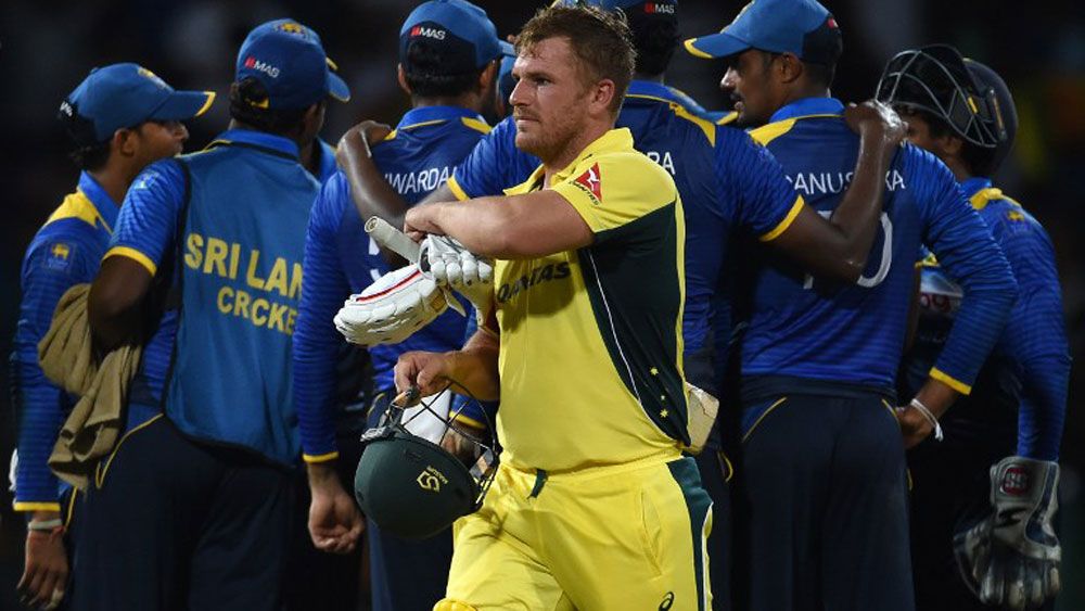 Aaron Finch leaves the ground after being dismissed by Sri Lanka's Amila Aponso during the first ODI between Sri Lanka and Australia